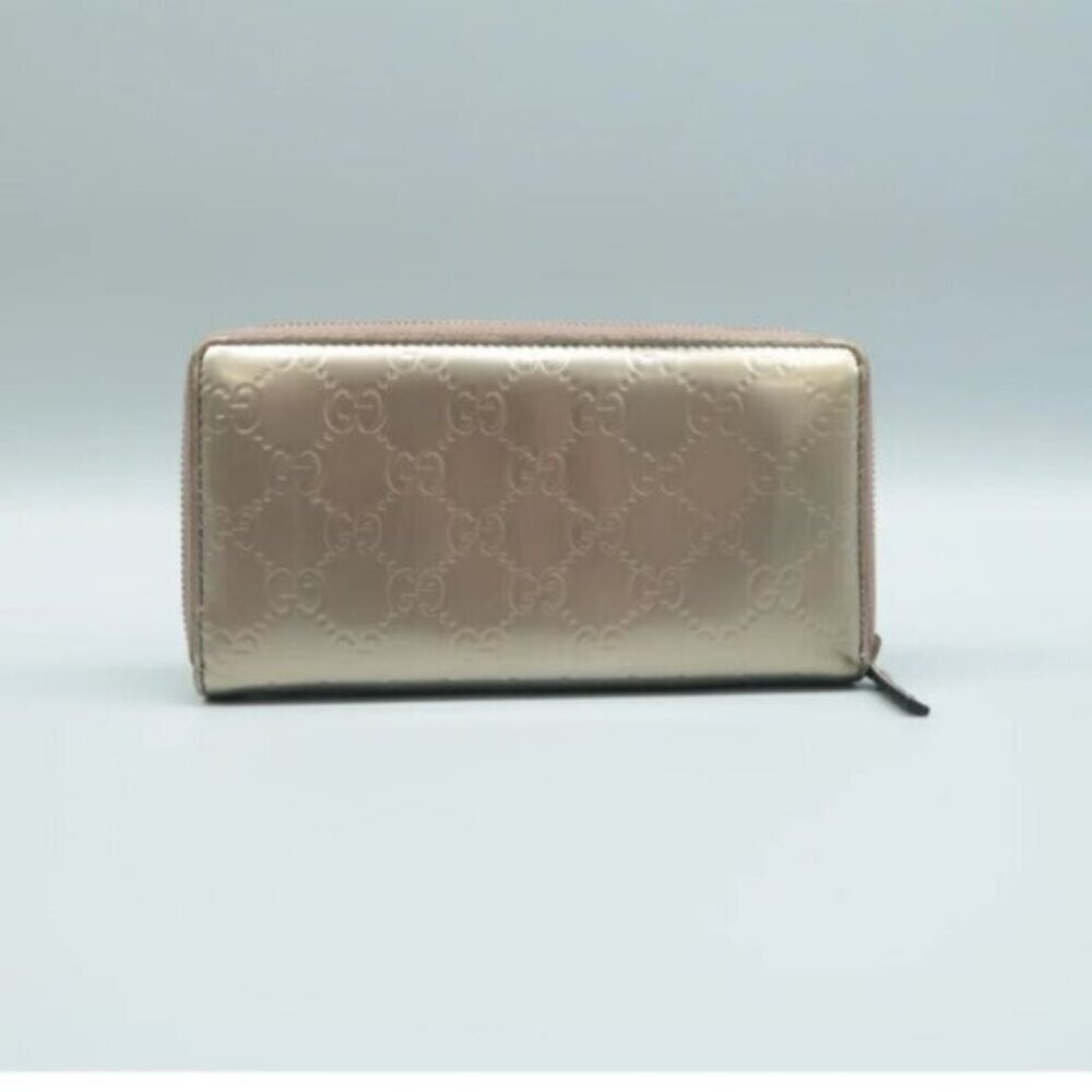 Authentic Gucci Champaigne Metallic Gold GG Tassel Zip Around Wallet - Picture 2 of 12